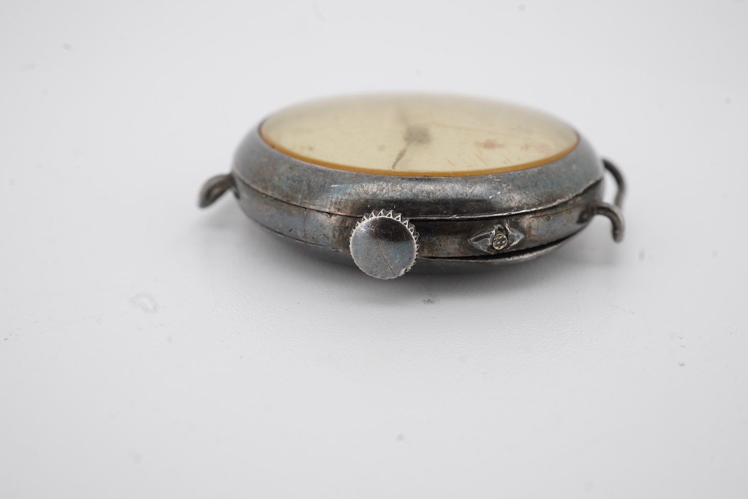 A lady's early 20th century silver nurse's or medic's manual wind wrist watch, with Red Cross symbol on the dial, engraved inscription on the back, 'Will to Mabel, 1916', case import marked for London, 1914, no strap.